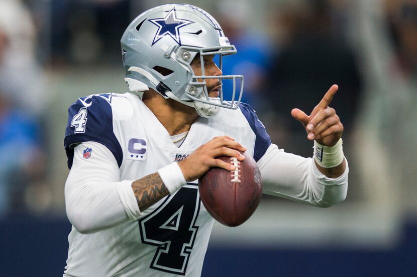 Dallas Cowboys quarterback Dak Prescott (4) looks for a receiver during the third quarter of...