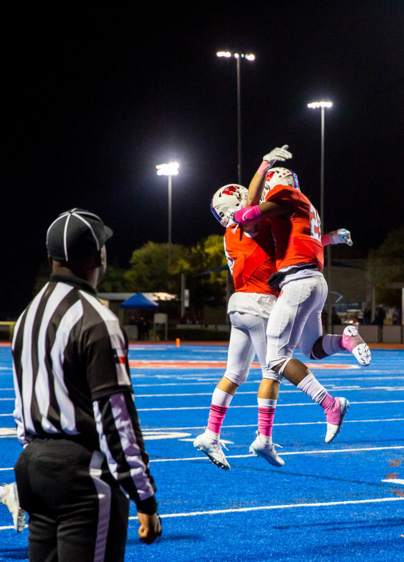 Parish Episcopal running back Cauren Lynch (28, right) celebrates a touchdown with a...