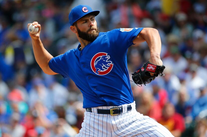 FILE - In this March 29, 2016, file photo, Chicago Cubs pitcher Jake Arrieta throws against...