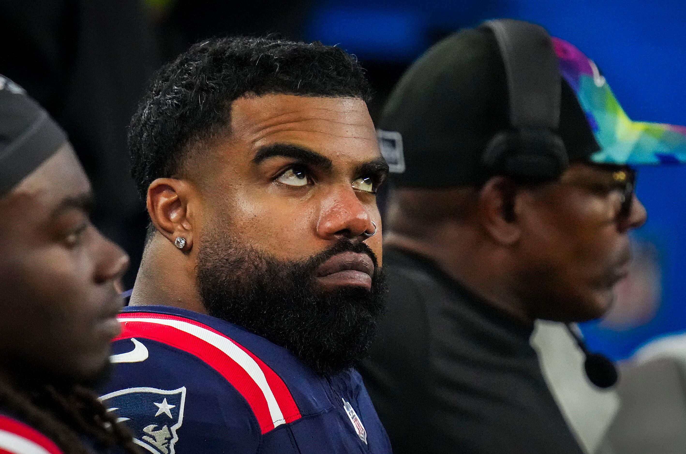 New England Patriots running back Ezekiel Elliott looks on from the bench during the second...