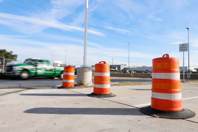 Orange traffic barrels are now set up at the bottom of the ramp of the Northaven Trail...