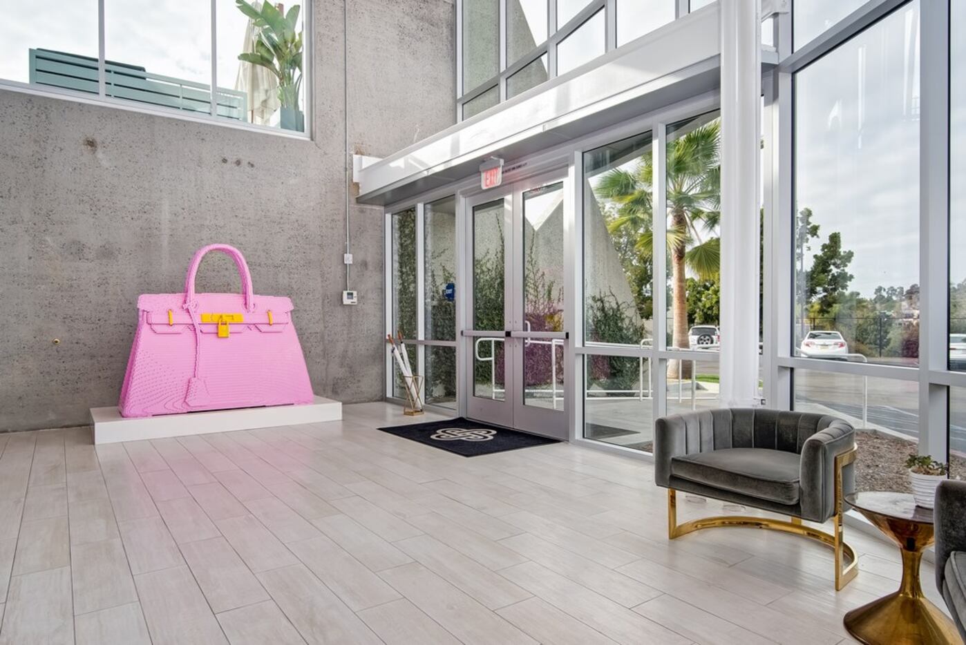 A giant pink Hermes Birkin bag sits in the lobby of Fashionphile's headquarters in Carlsbad,...