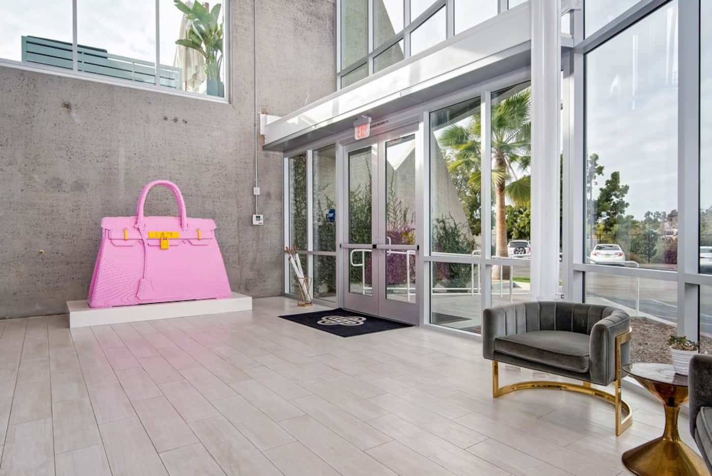 A giant pink Hermes Birkin bag sits in the lobby of Fashionphile's headquarters in Carlsbad,...