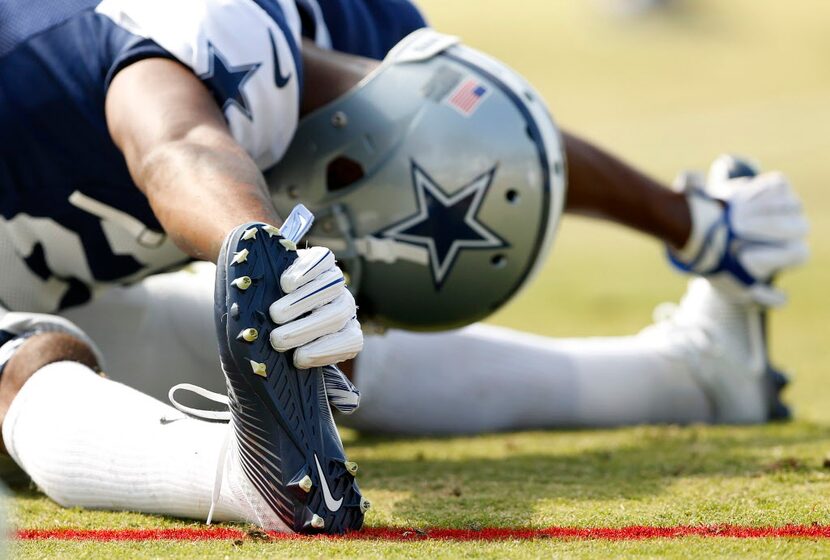 Dallas Cowboys defensive back Josh Thomas (26) stretches before afternoon practice at...