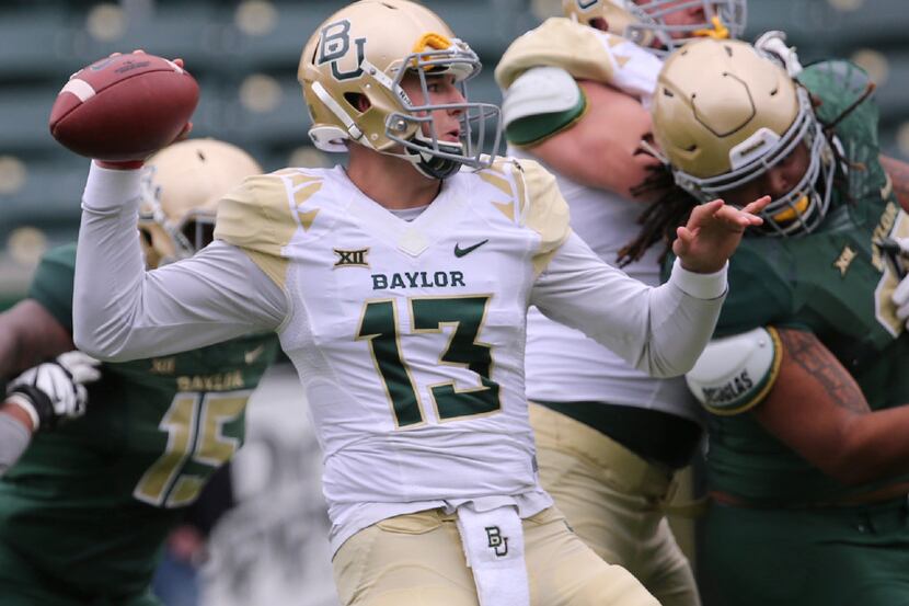 Baylor quarterback Zach Smith (13) passes during the first half of the NCAA college football...