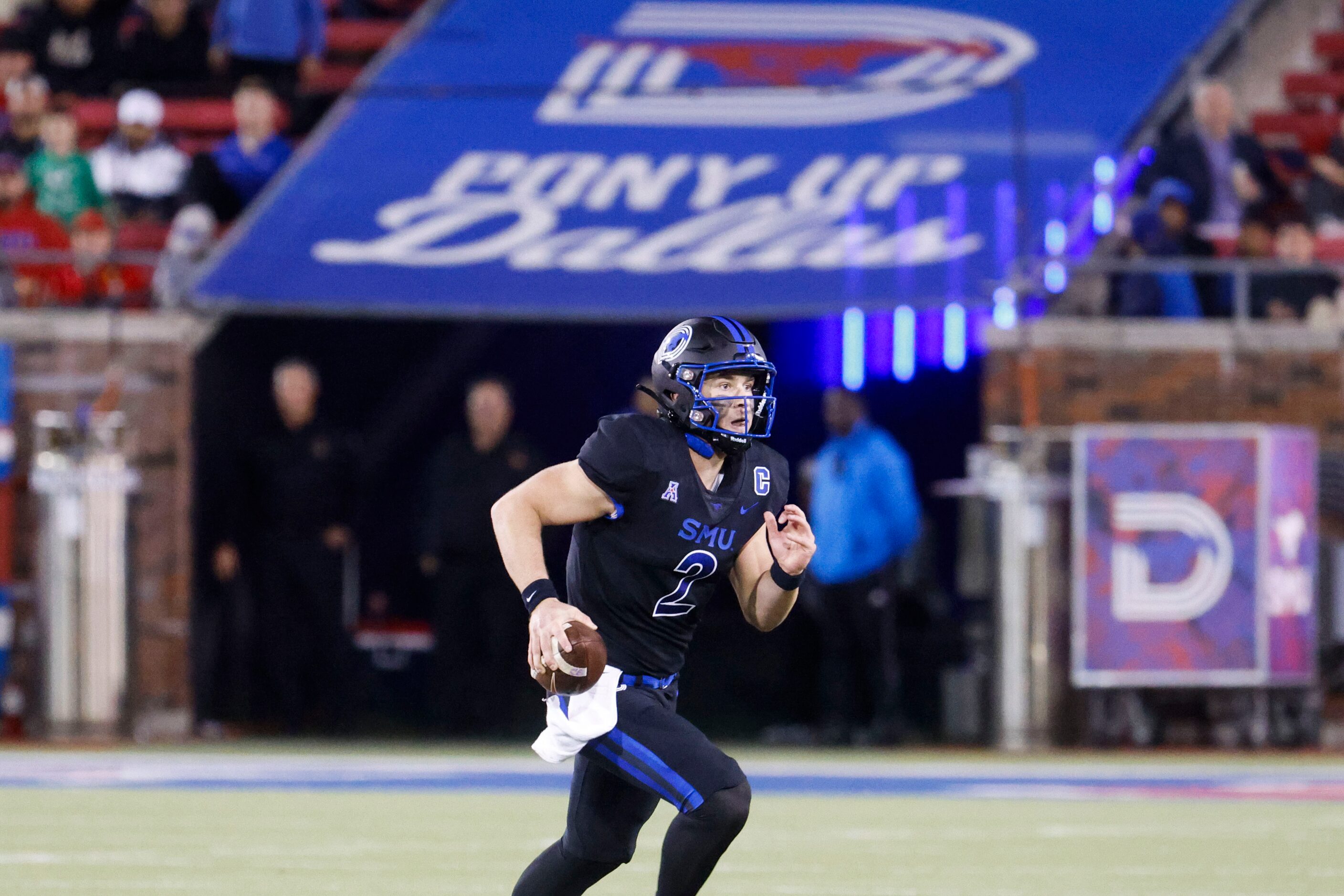 Southern Methodist Mustangs quarterback Preston Stone runs with the ball against UNT during...