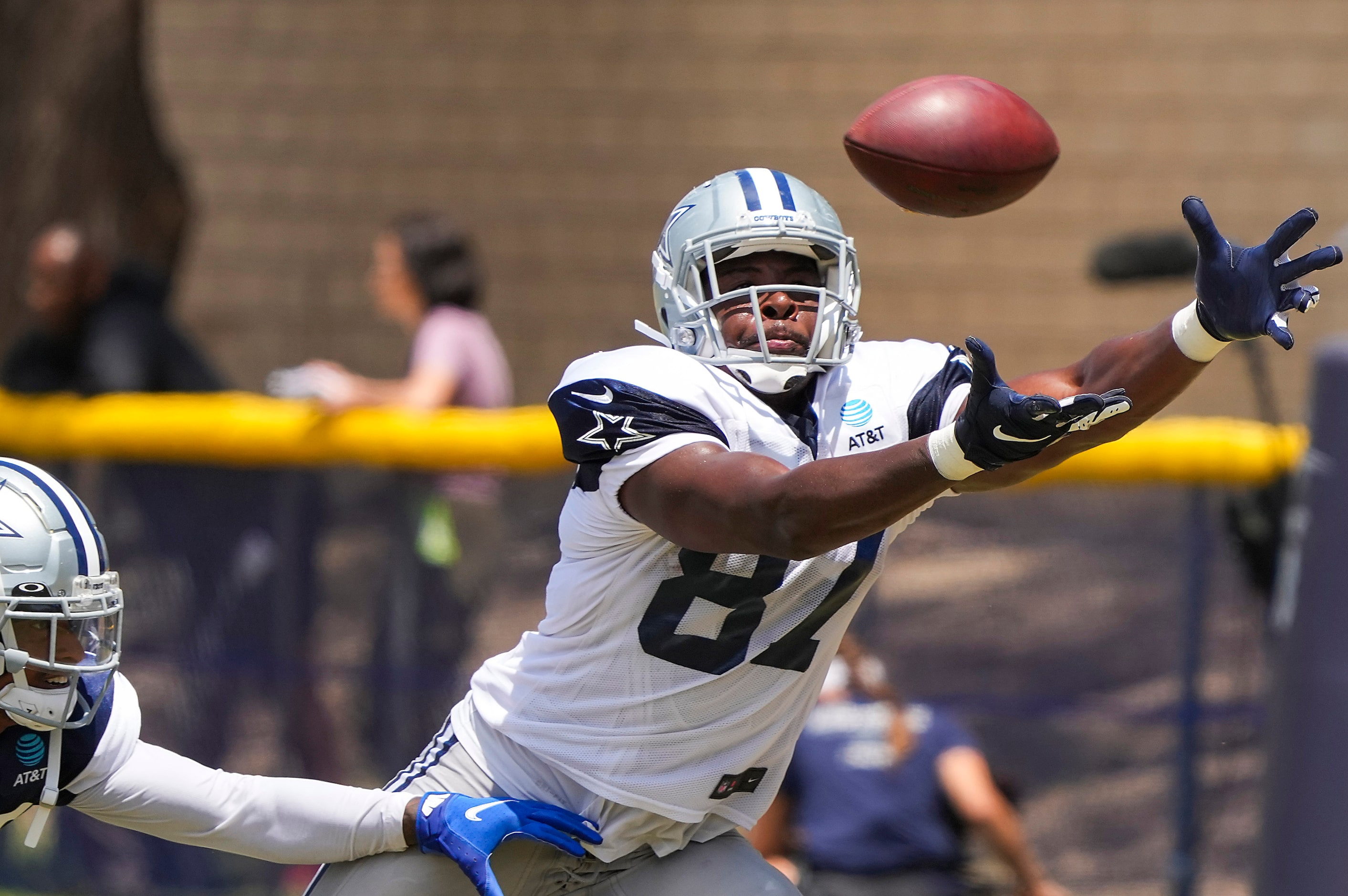 Dallas Cowboys tight end Jeremy Sprinkle (87) reaches for a pass during a practice at...