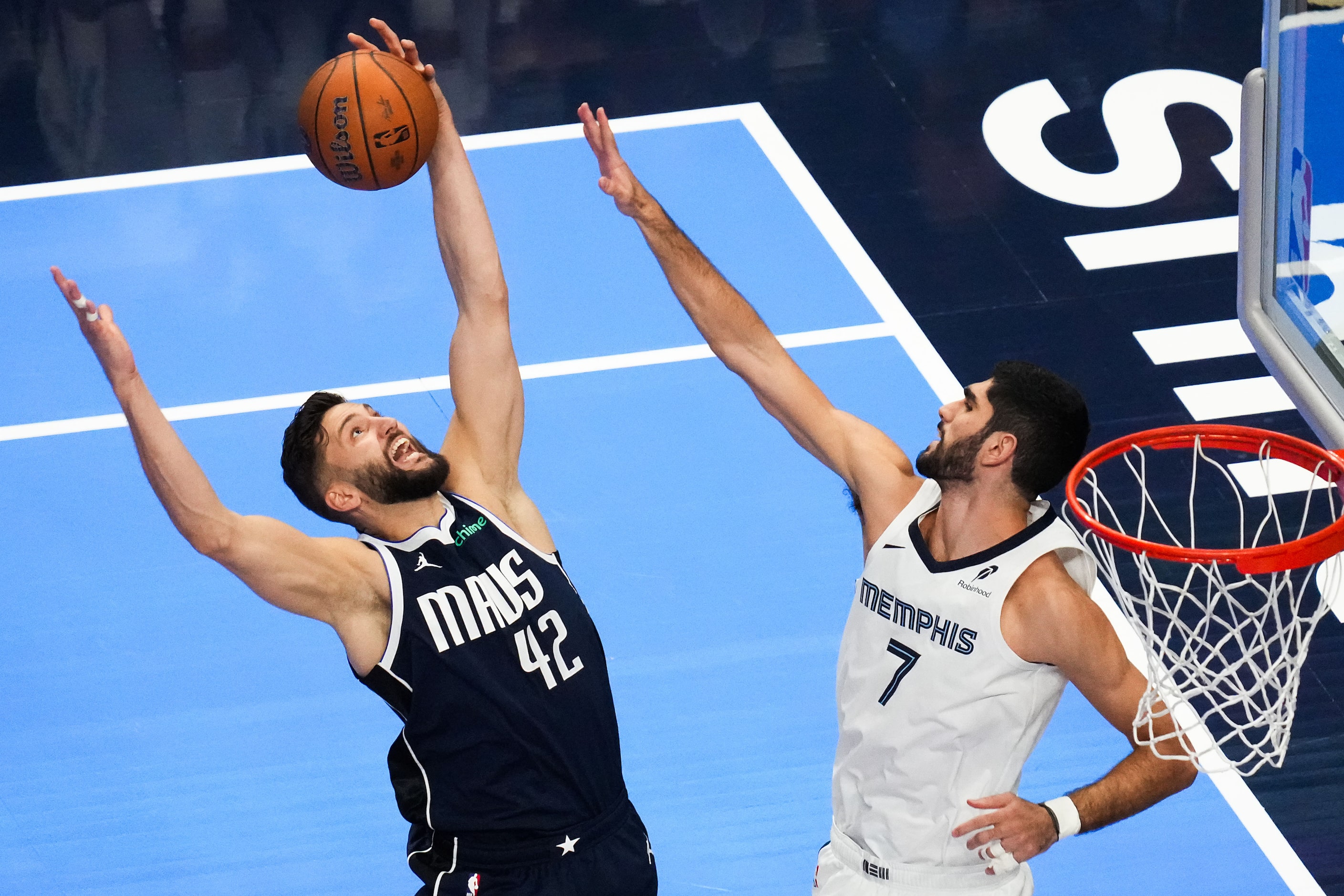 Dallas Mavericks forward Maxi Kleber (42) grabs a rebound against Memphis Grizzlies forward...