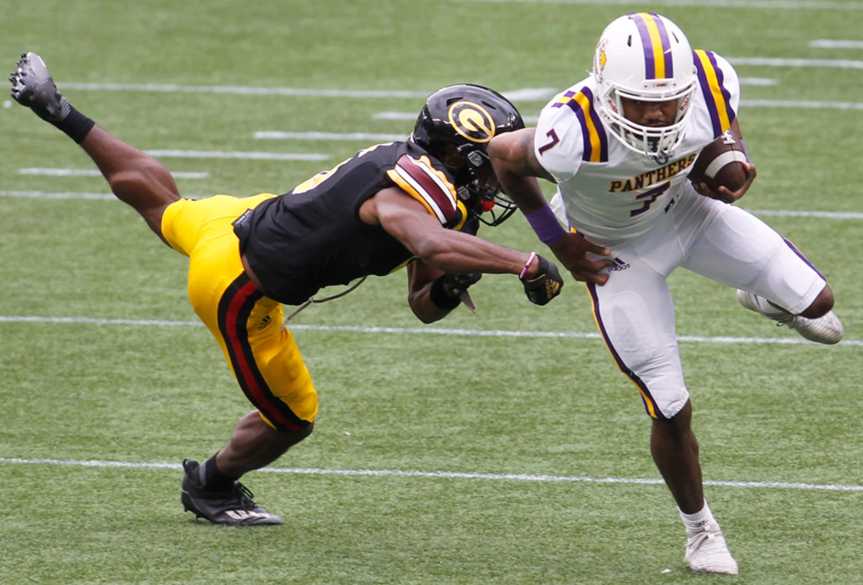Prairie A&M receiver Kristian Mosely (7) sidesteps the defensive pursuit of Grambling State...