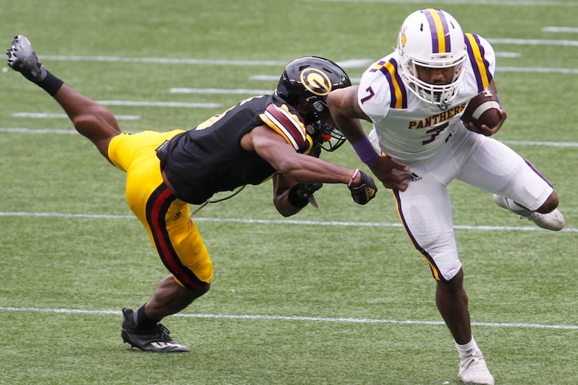 Prairie A&M receiver Kristian Mosely (7) sidesteps the defensive pursuit of Grambling State...