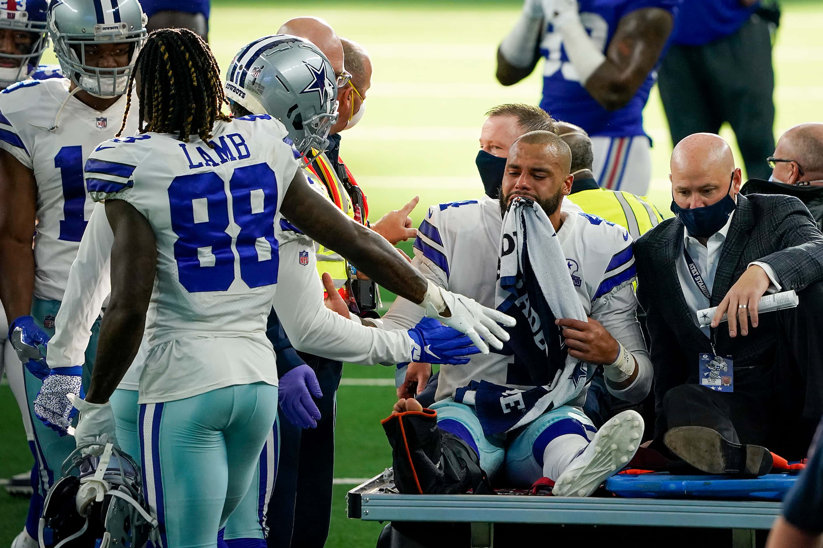 Dallas Cowboys quarterback Dak Prescott leaves the field on a cart after beig injured on a...