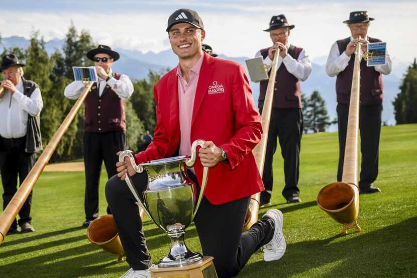 Winner Ludvig Aberg of Sweden poses with the trophy of the Omega European Masters Golf...
