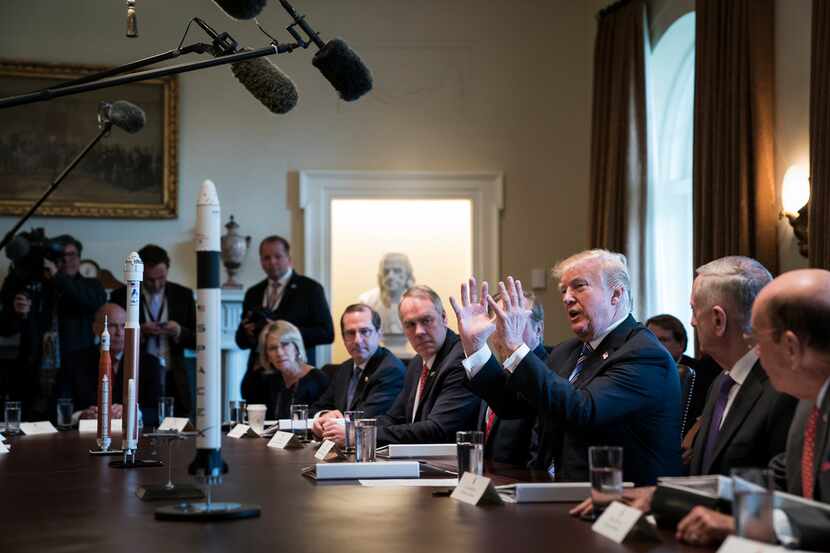 President Donald Trump speaks during a cabinet meeting Thursday at the White House. Trump...