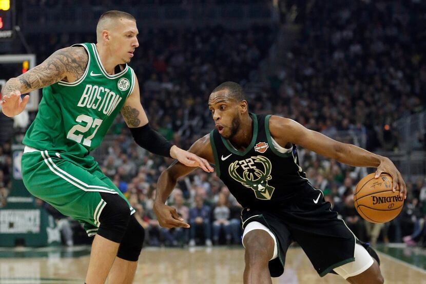 Milwaukee Bucks' Khris Middleton drives to the basket against Boston Celtics' Daniel Theis...