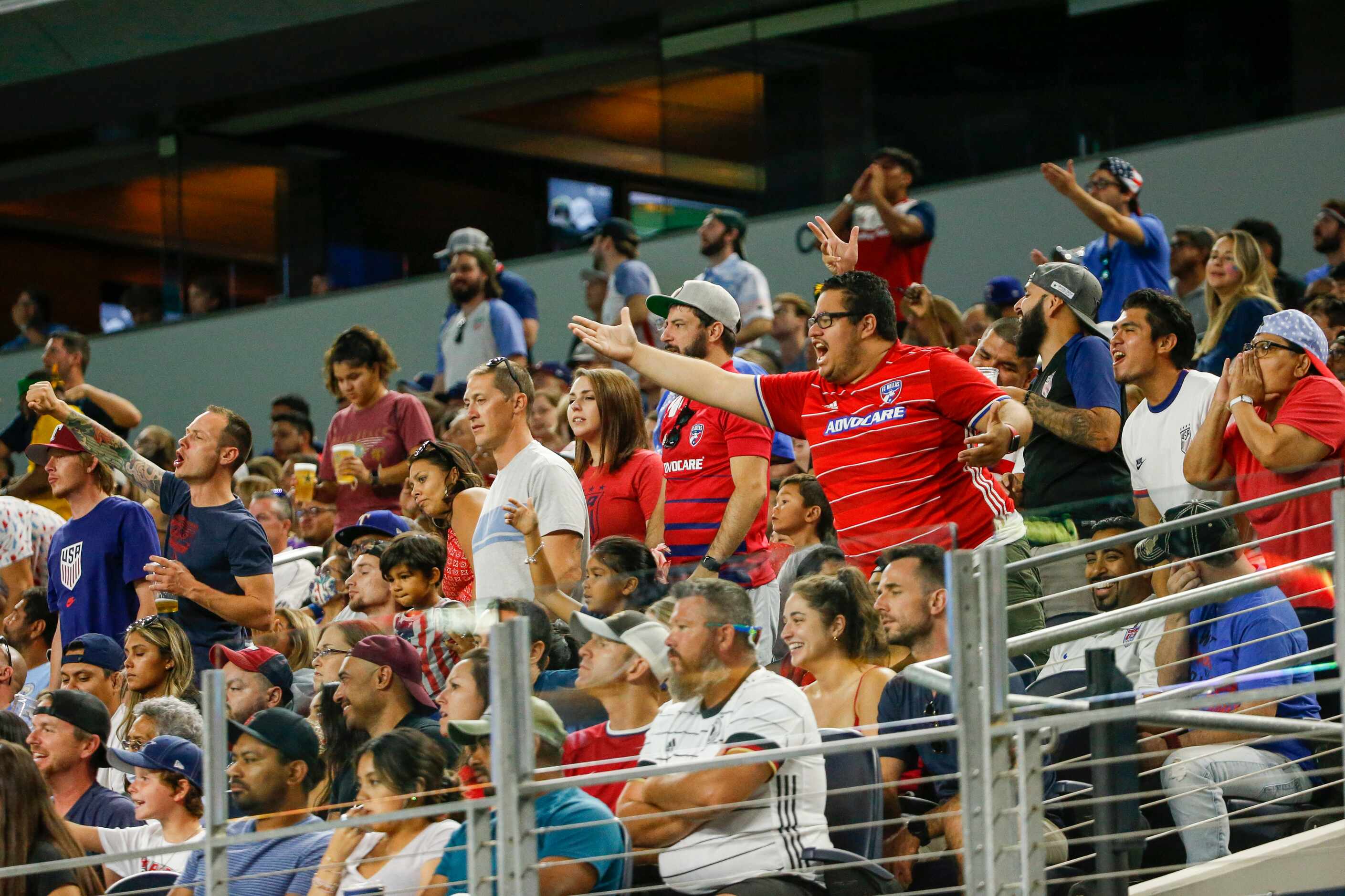 Fans react during the first half of a CONCACAF Gold Cup quarterfinal soccer match between...