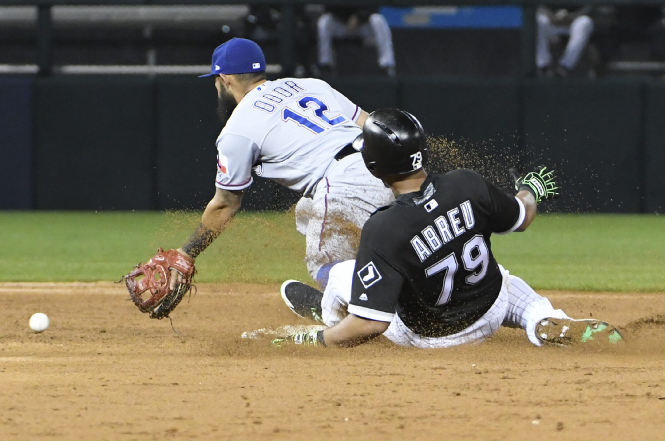 CHICAGO, IL - MAY 18: Jose Abreu #79 of the Chicago White Sox slides safely into second base...