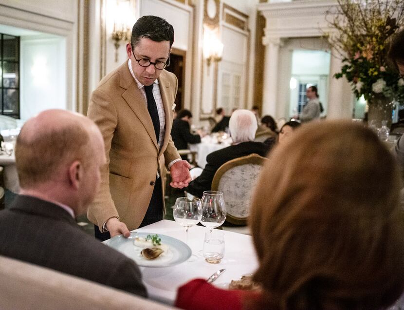 General Manager Victor Rojas serves a dish at the French Room. 