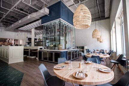 Diners will notice the dramatic wine cellar that serves as a centerpiece at Sachet in Dallas.