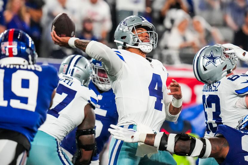 Dallas Cowboys quarterback Dak Prescott (4) throws a pass during the first half of an NFL...