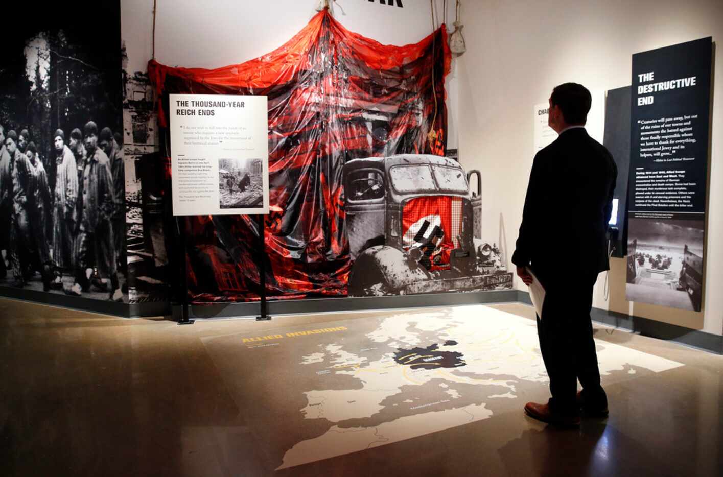 Dallas County Judge Clay Jenkins takes in an exhibit at the new Dallas Holocaust and Human...
