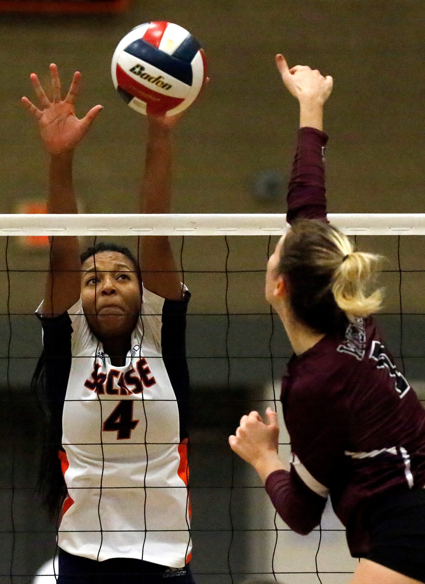 Sachse High School outside hitter Shaliyah Rhoden (4) attempts to block Wylie High School...