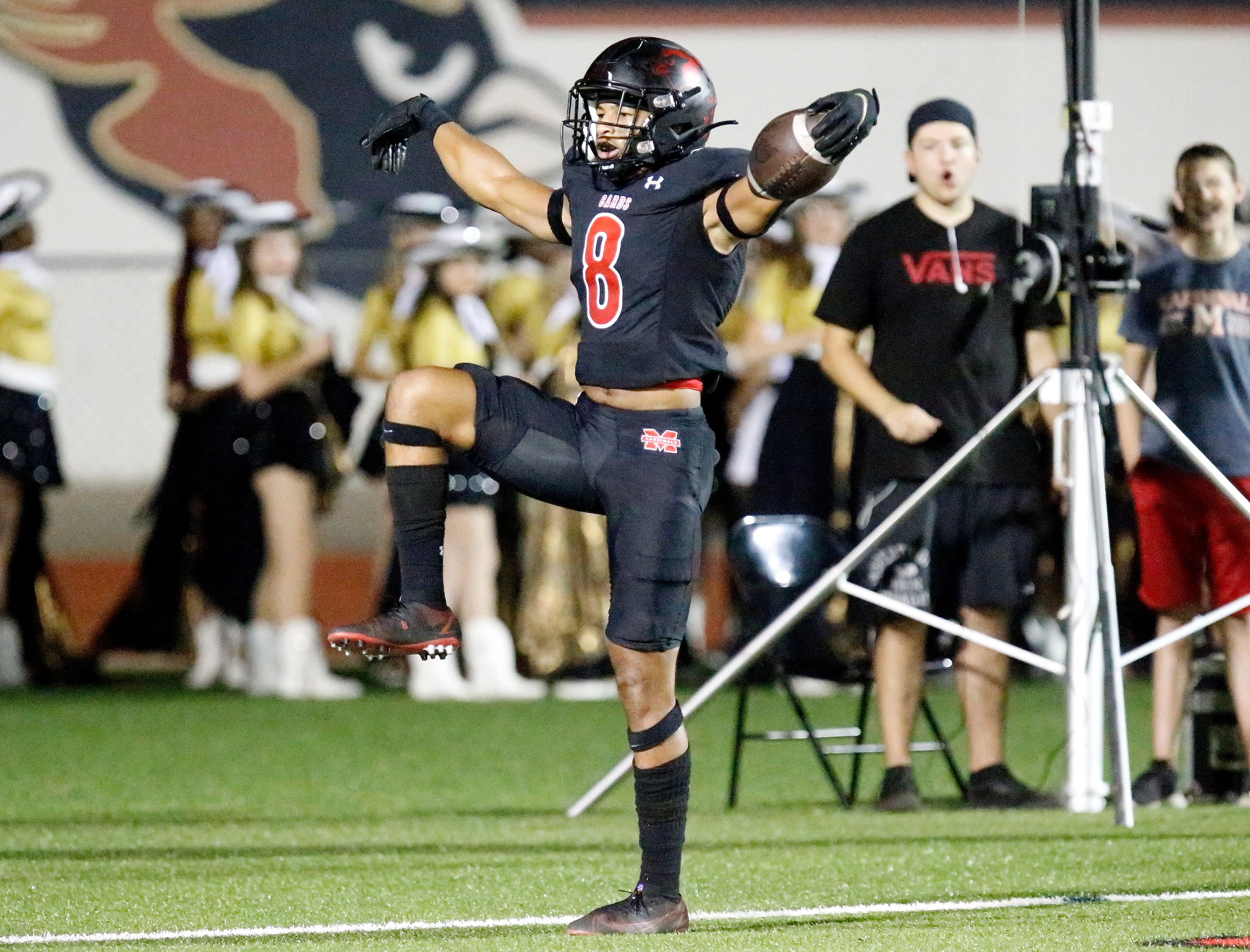 Melissa High School running back Jacob Fields (8) celebrates a touchdown run during the...