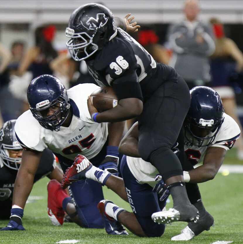 Allen High School de, dl Levi Onwuzurike (95) looks on as Allen High School de, dl Cody...