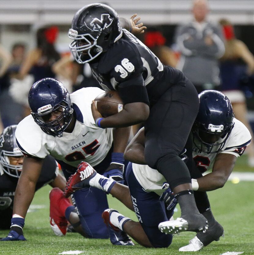 Allen High School de, dl Levi Onwuzurike (95) looks on as Allen High School de, dl Cody...