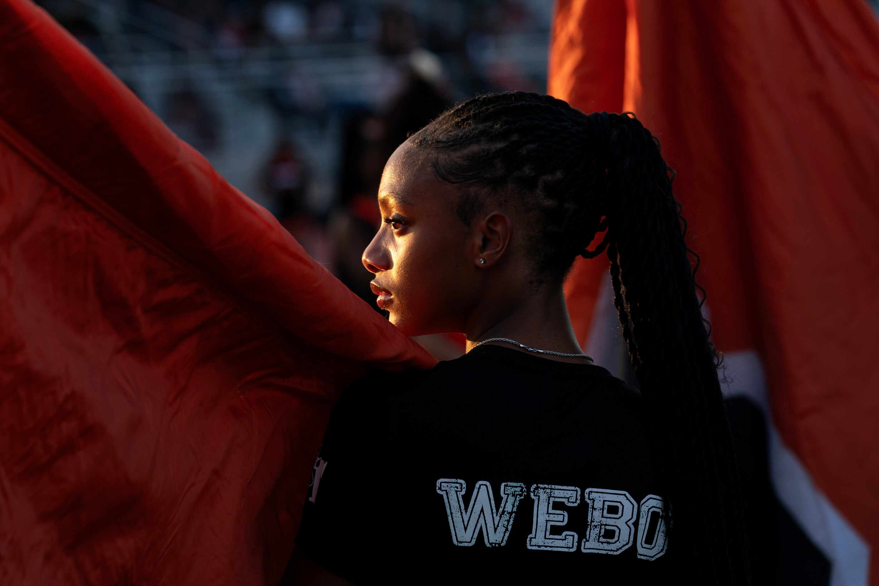 Milan Lathan, a member of the Lancaster girls track team, prepares to run a flag onto the...
