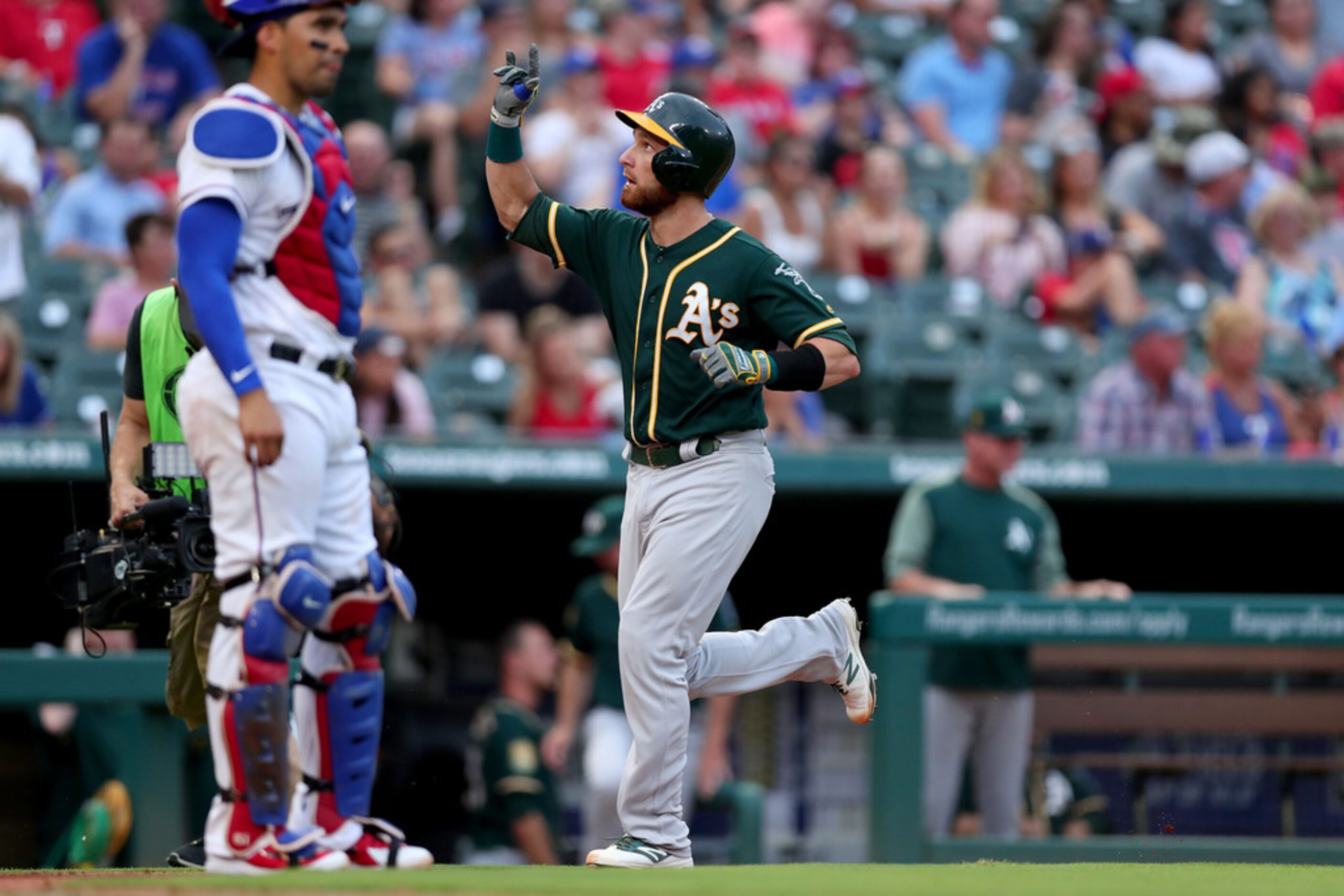 ARLINGTON, TX - JULY 23:  Jonathan Lucroy #21 of the Oakland Athletics celebrates after...