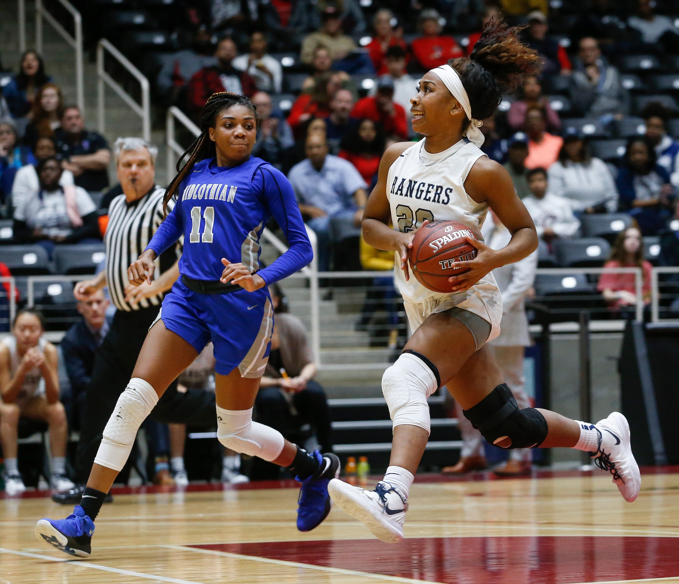 Frisco Lone Star's Halley Carr drives to the basket past Midlothian's Maykayla Jackson (11)...