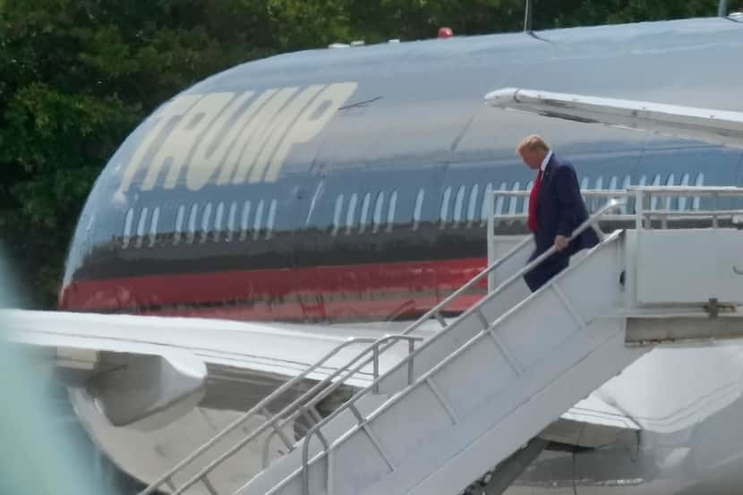 Former President Donald Trump arrives at Miami International Airport, Monday, June 12, 2023.