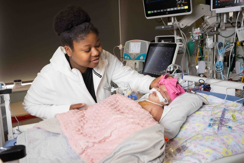 Brianna Hogg checks on her four-month-old daughter Ja’khaia Williams at Medical City...