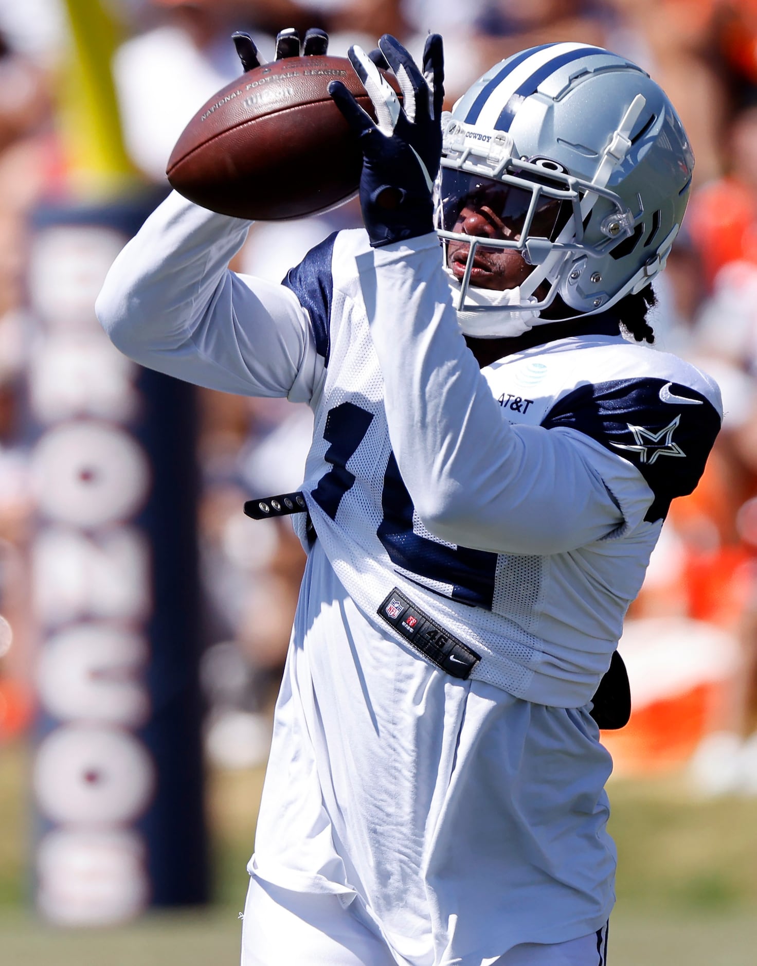 Dallas Cowboys wide receiver Dontario Drummond (19) pulls in a pass prior to practicing with...