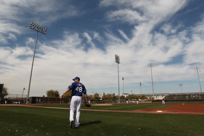 Colby Lewis prepares to start an intra-squad game during Texas Rangers Spring Training at...