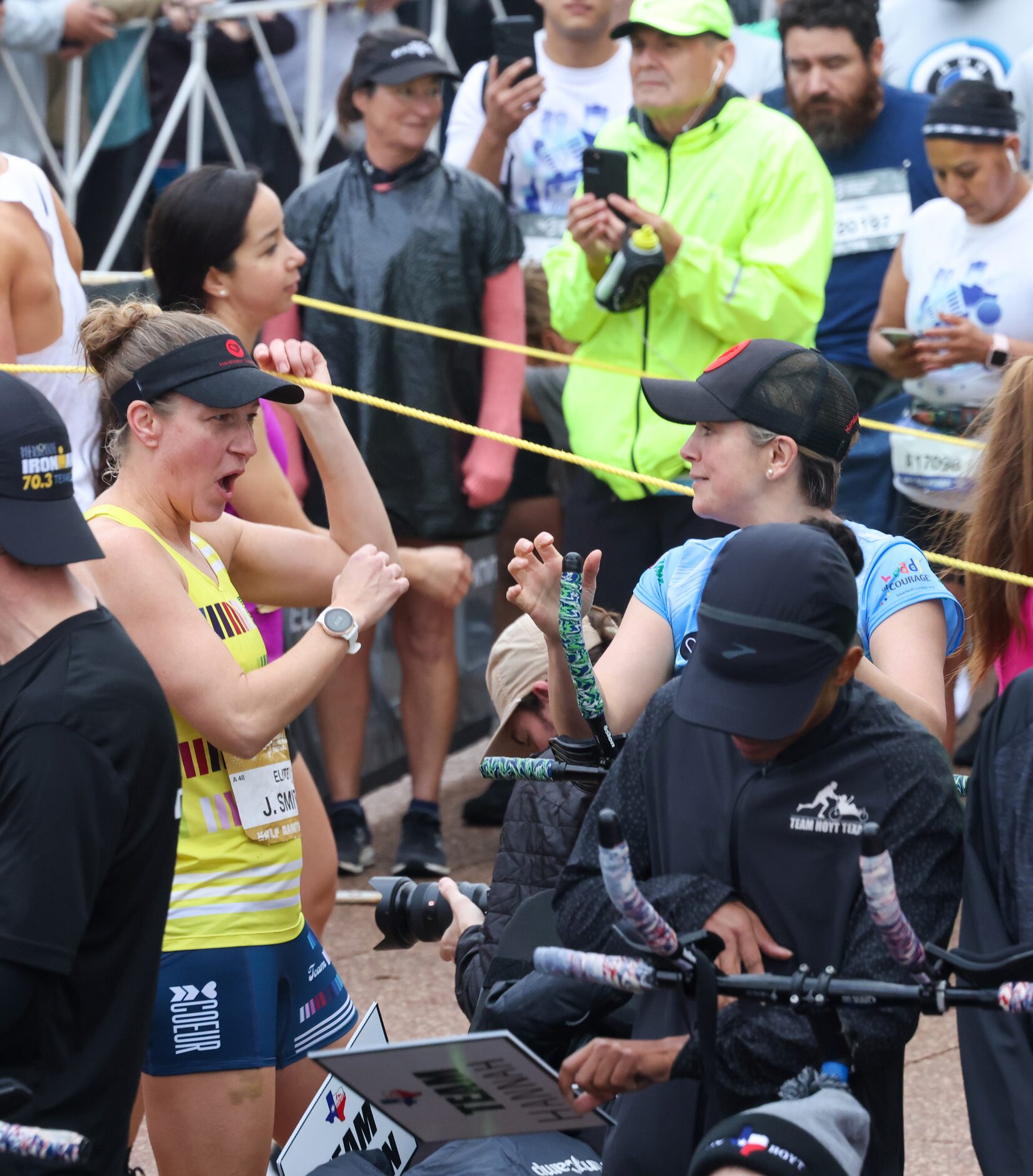 Runners greet each other at the starting line in front of Dallas City Hall before BMW Dallas...