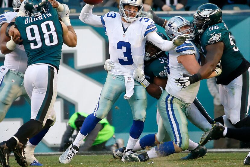 Dallas Cowboys quarterback Mark Sanchez (3) is sacked by Philadelphia Eagles defensive end...