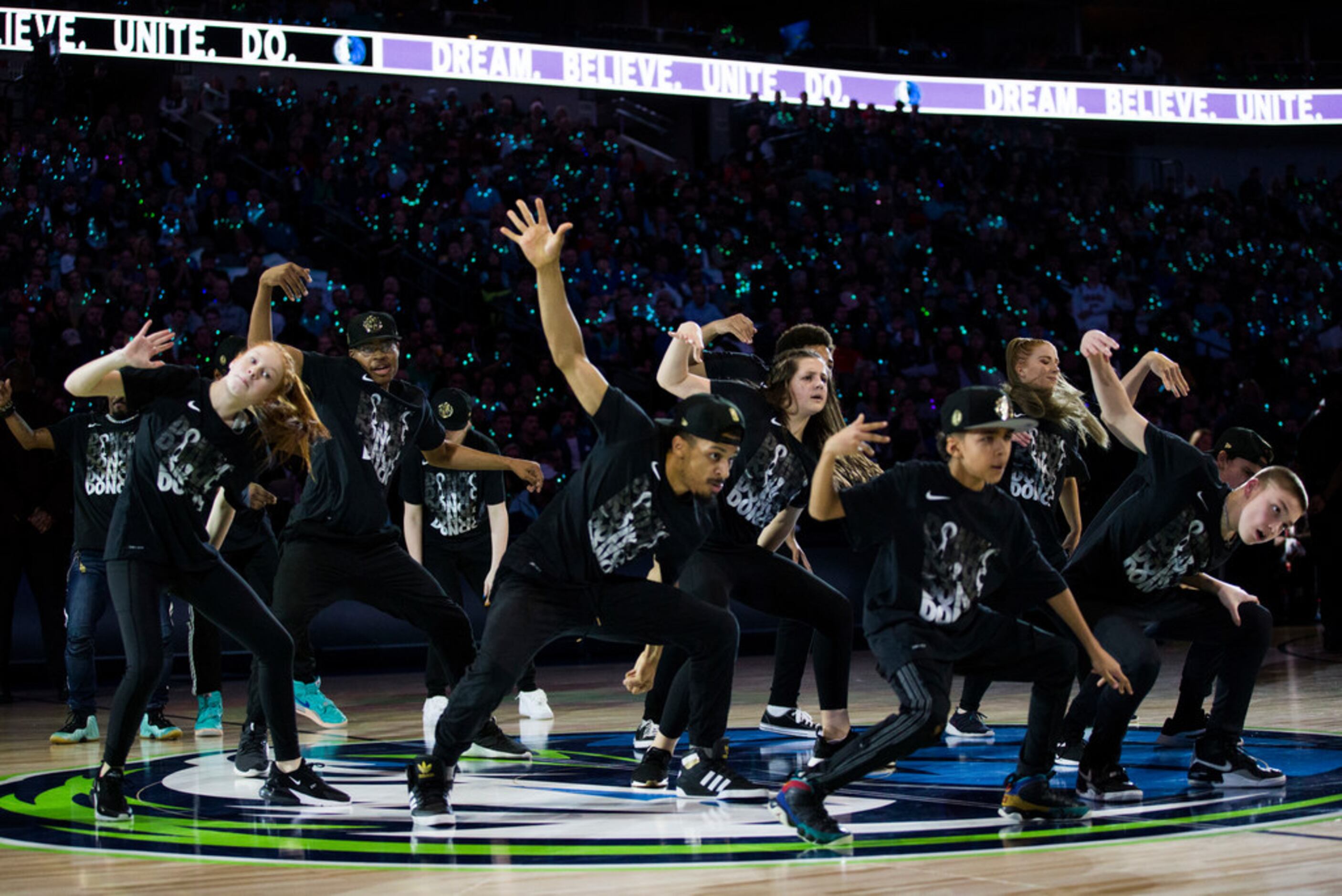 Dancers perform an MLK Day routine during a timeout in the first quarter of an NBA game...