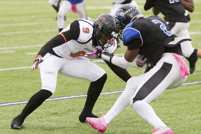 Tigers defensive back Dajuan Adkinson (9) prepares to land a tackle during Lancaster's...