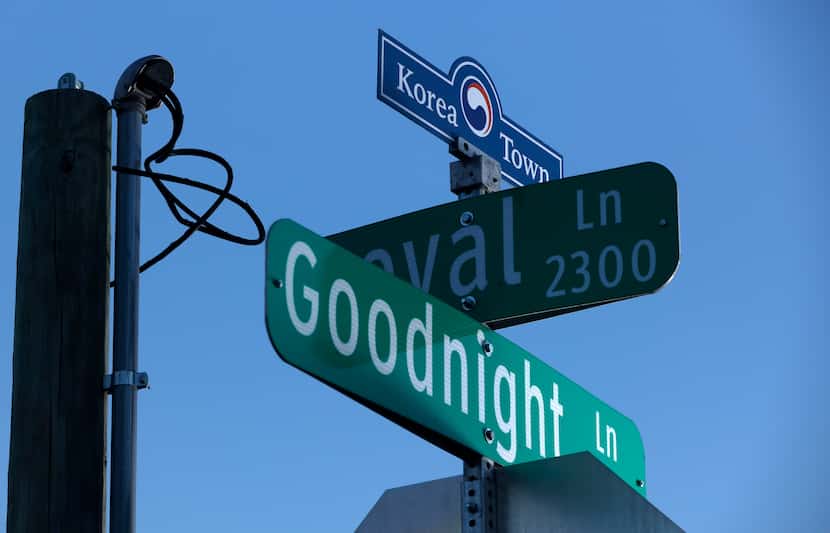 A Korea Town sign sits atop a street sign along Royal Lane in Dallas, December 14, 2023.