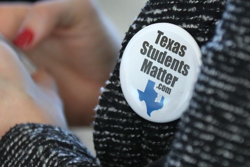Dallas area superintendents and trustees wear "Texas Students Matter" buttons before a...