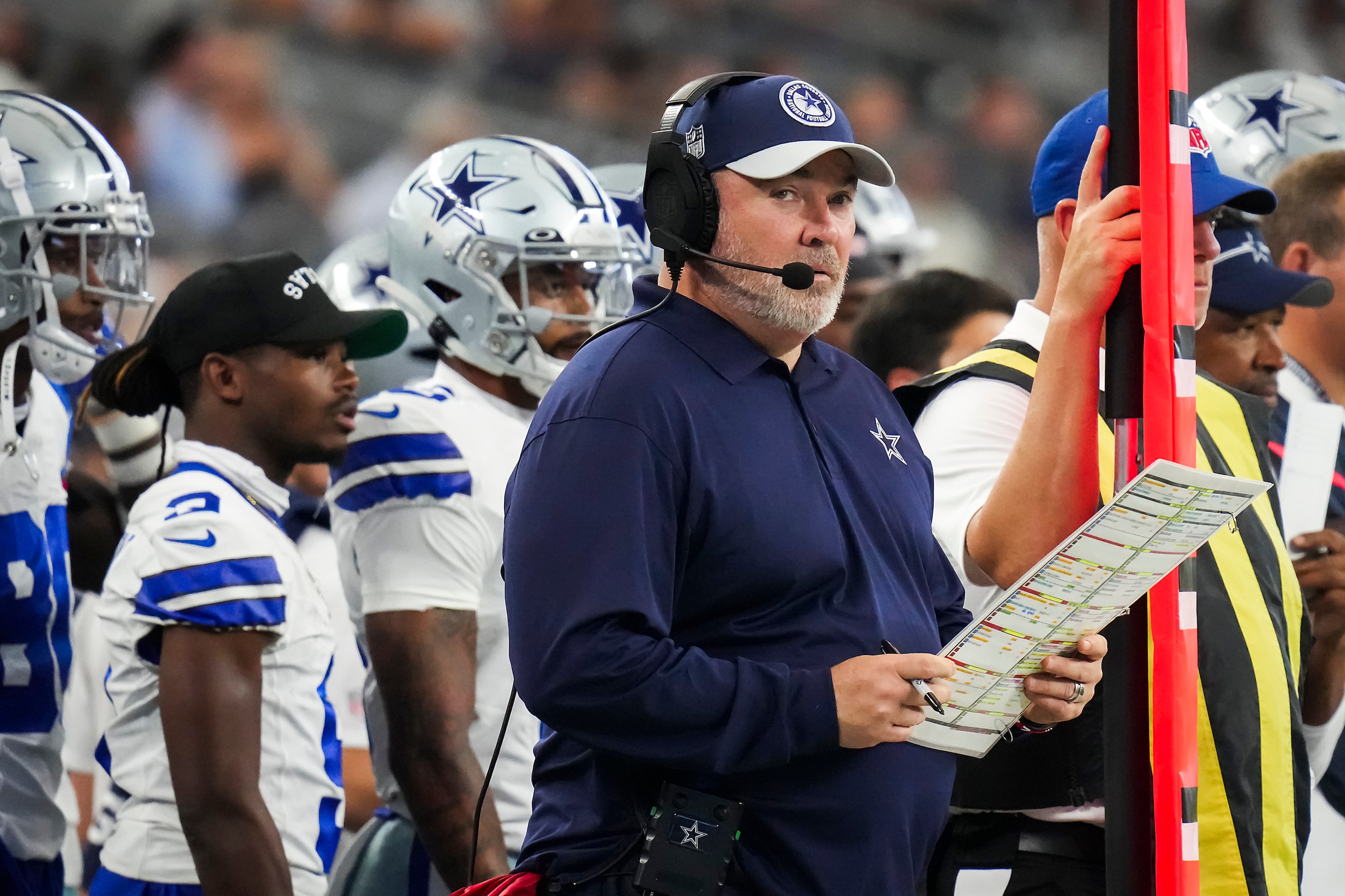 Dallas Cowboys head coach Mike McCarthy looks on after sending in a play to his offense...