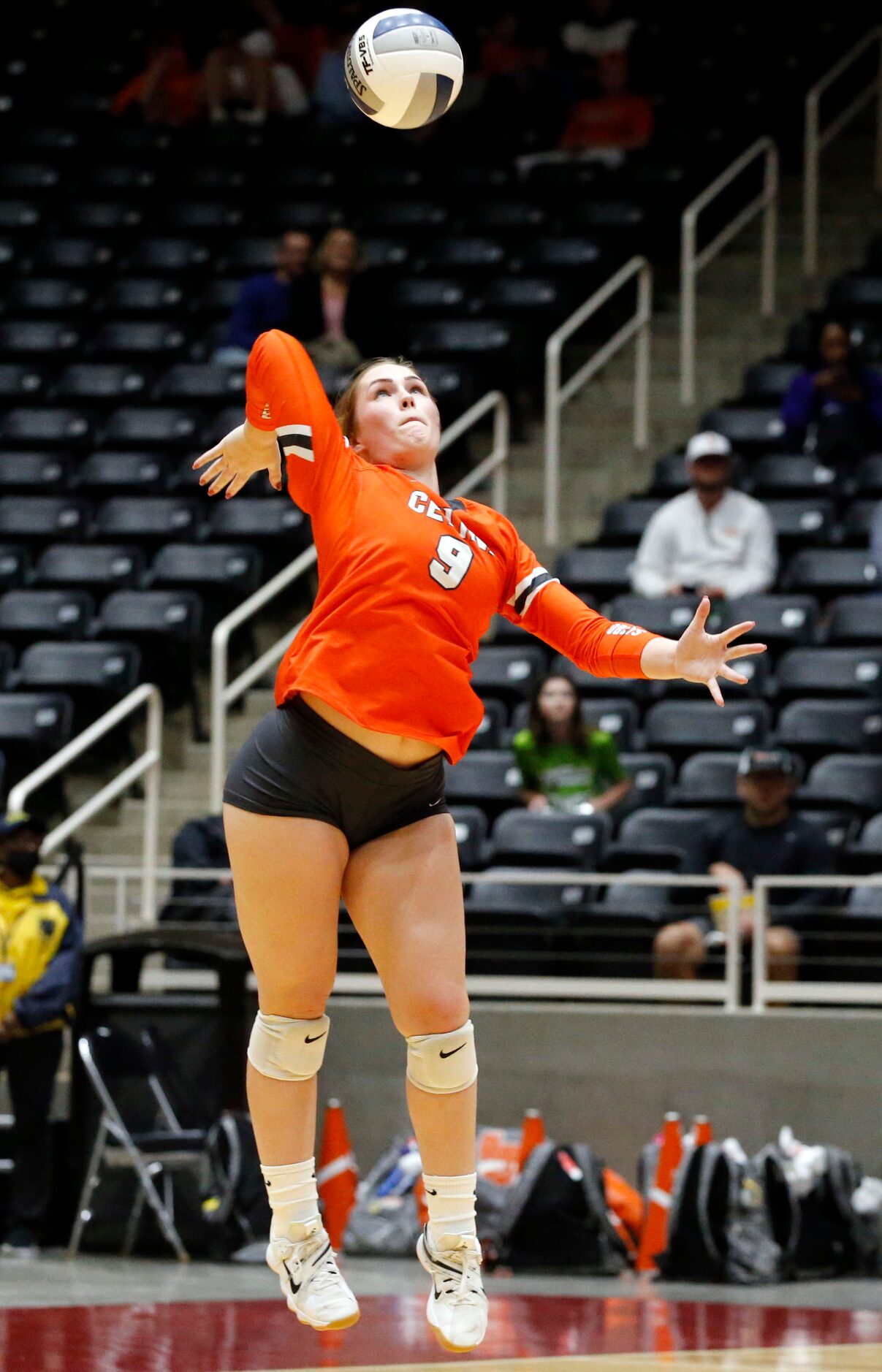 Celina's Megan Hodges (9) serves during the Class 4A state semifinal volleyball match...