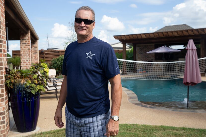 Mike Owens poses for a photo in front of his pool. He has been using the Swimply app to rent...