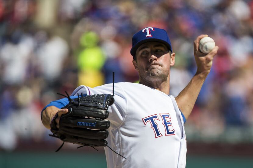 Texas Rangers starting pitcher Cole Hamels pitches during the first inning against the...