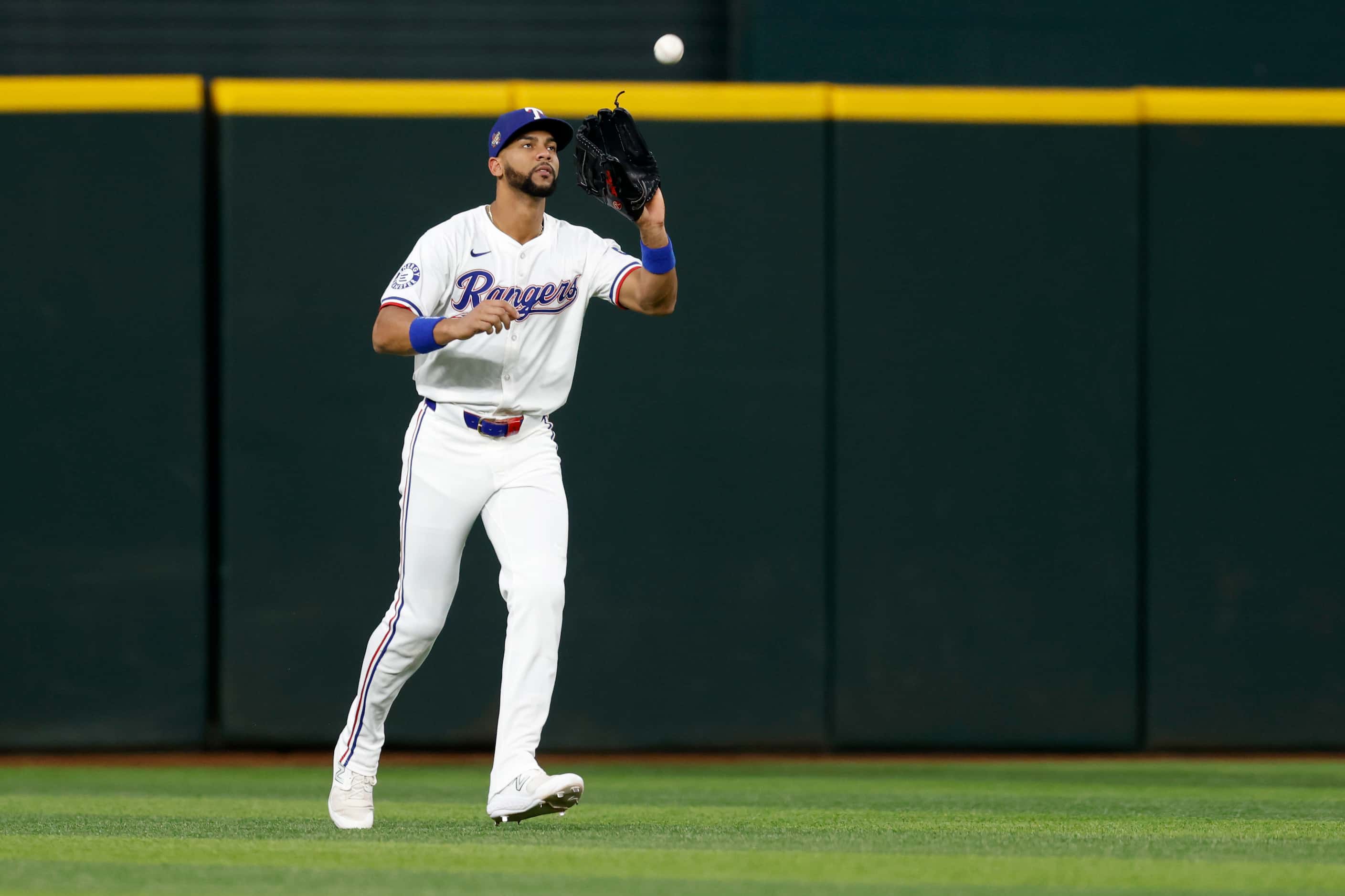 Texas Rangers center fielder Leody Taveras (3) catches a fly ball off the bat of Kansas City...