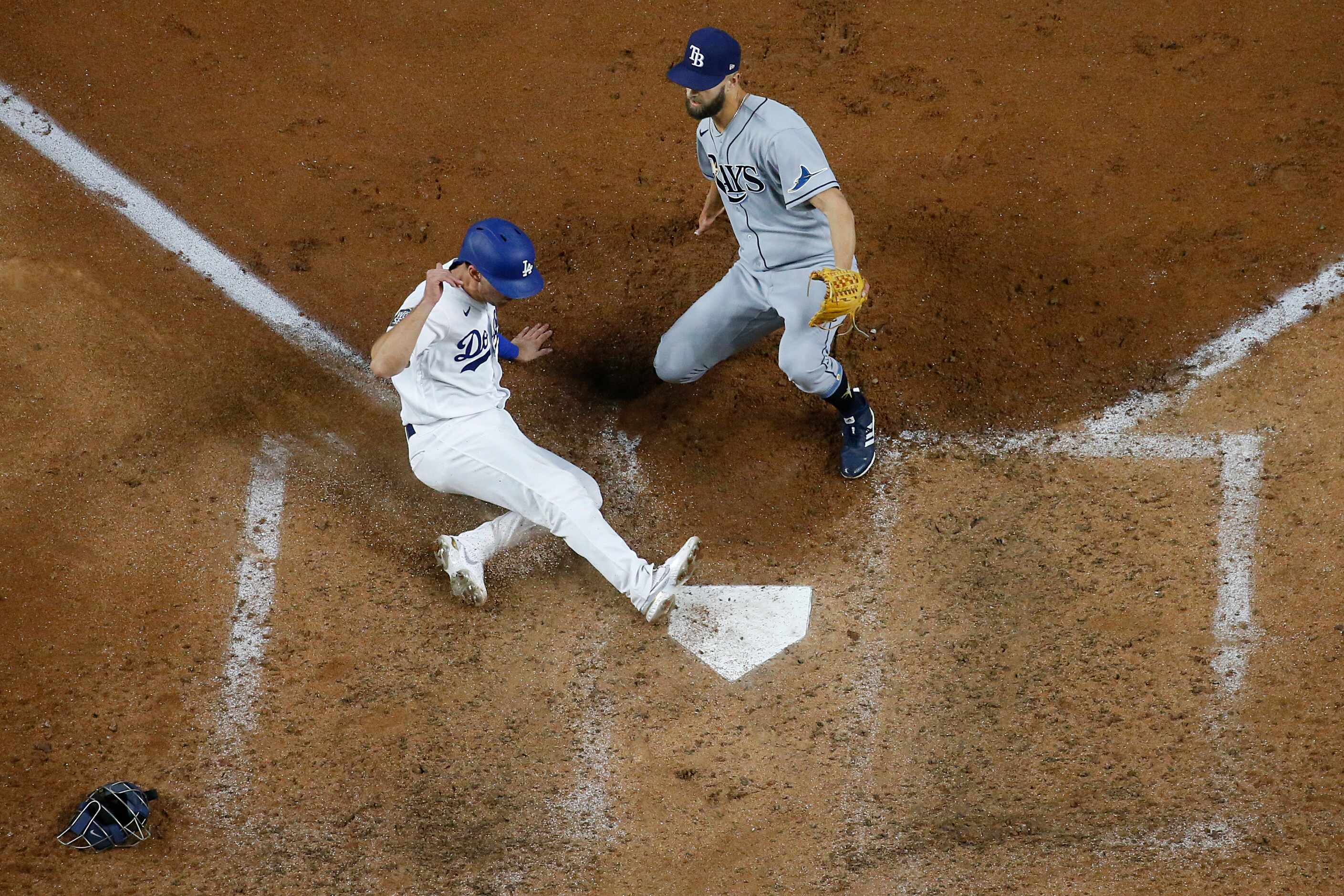 Los Angeles Dodgers catcher Austin Barnes (15) scores past Tampa Bay Rays relief pitcher...