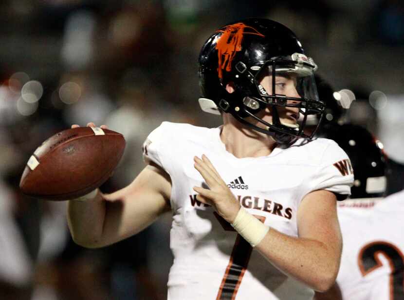 West Mesquite QB Conner Neill (7) looks for a receiver action from the first half of a high...