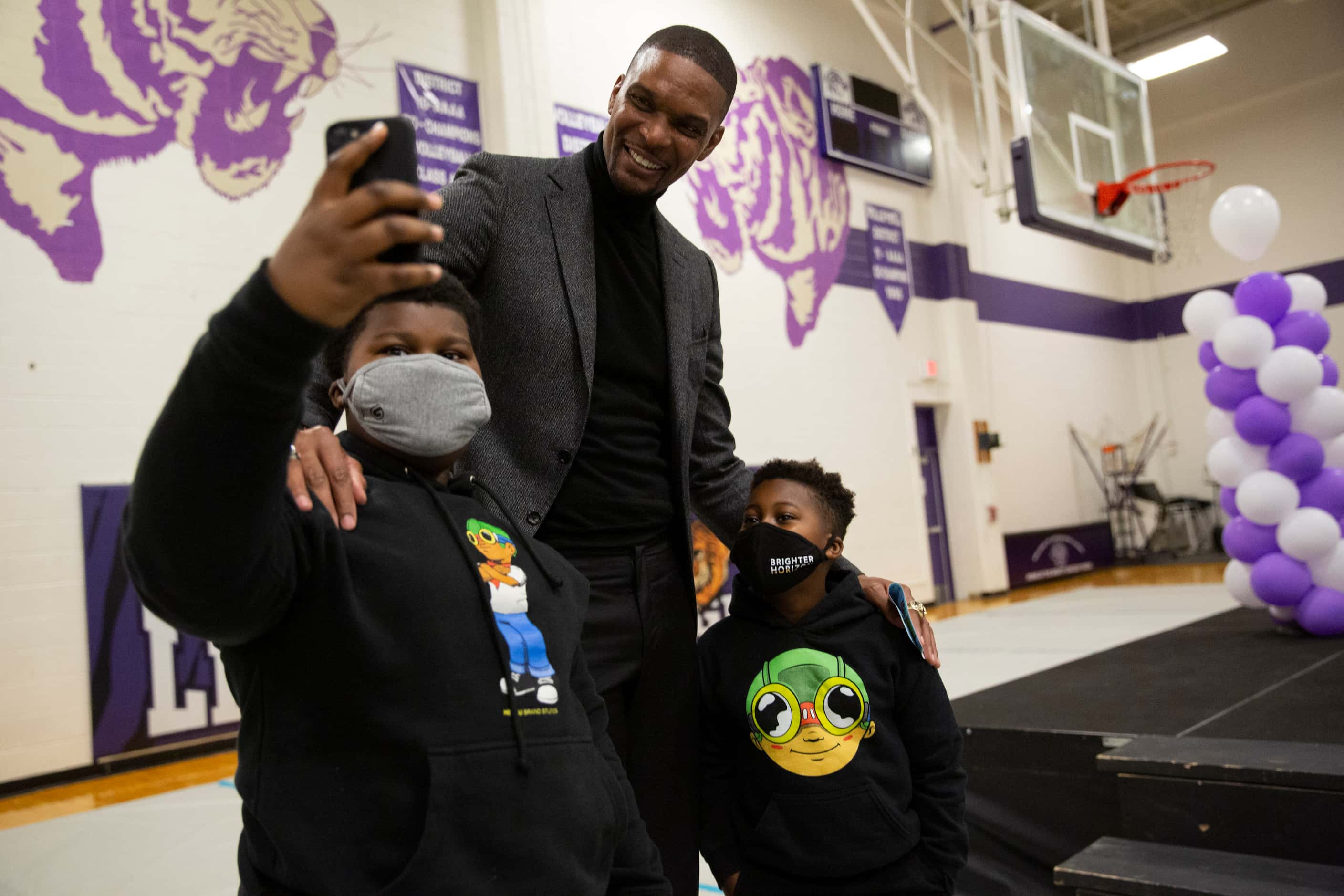 Yusuf Robinson, 11, (CQ) (left), takes a selfie with brother Amir Robinson, 8 (CQ) (right),...