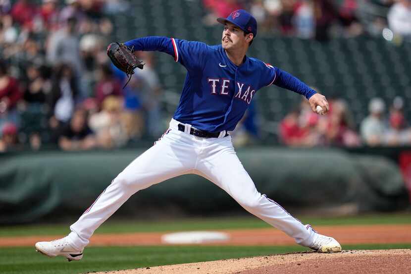Texas Rangers starting pitcher Cole Ragans delivers during the first inning of a spring...